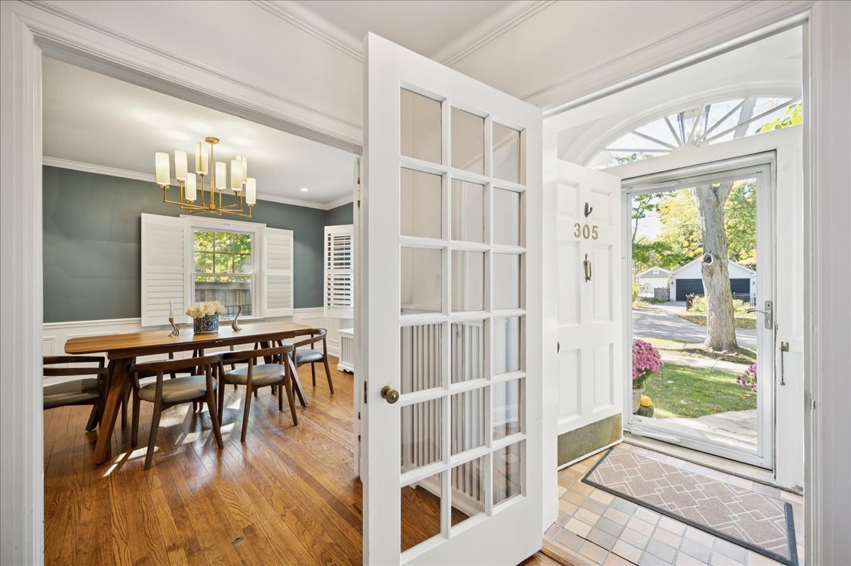 305 Poplar Street Winnetka, IL 60093 - Photo 5 of 26 a dining room with wooden floor table and chairs