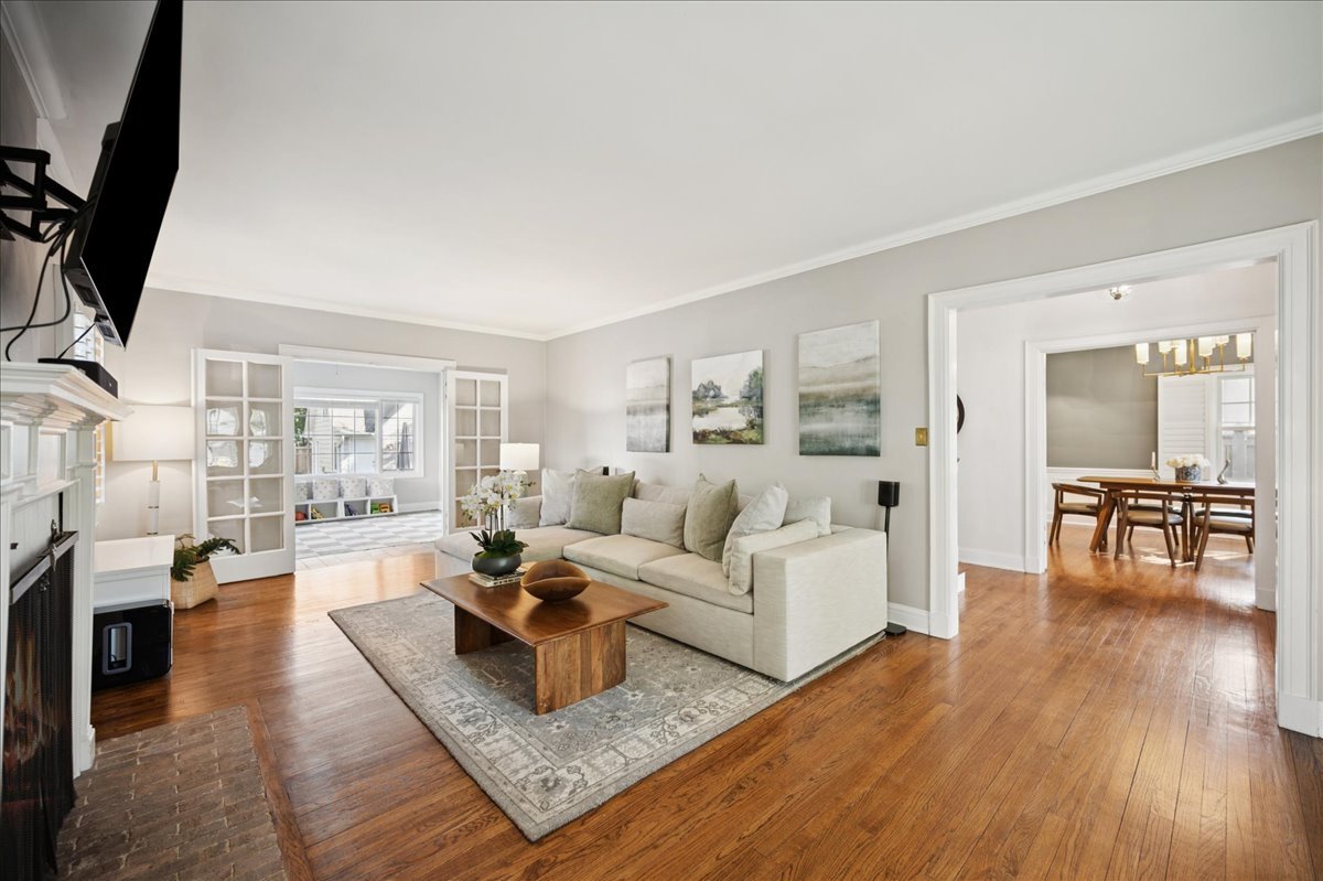 305 Poplar Street Winnetka, IL 60093 - Photo 7 of 26 a living room with fireplace furniture and a flat screen tv