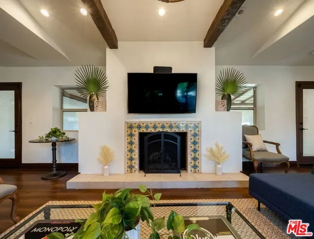 a bedroom with two beds and a dresser