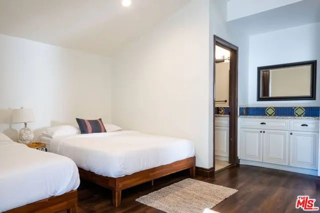 a bedroom with a bed and a closet