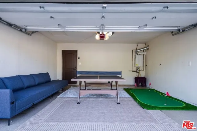 a patio with a table and chairs