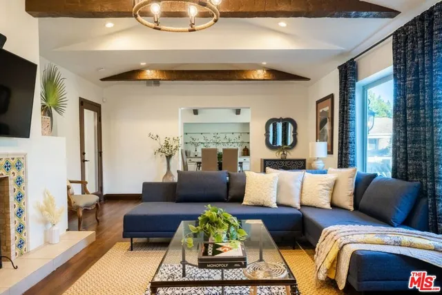 a kitchen with stainless steel appliances granite countertop a lot of counter space and wooden floors
