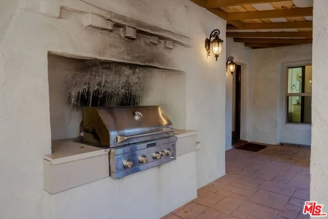 a view of a livingroom with furniture and a potted plant