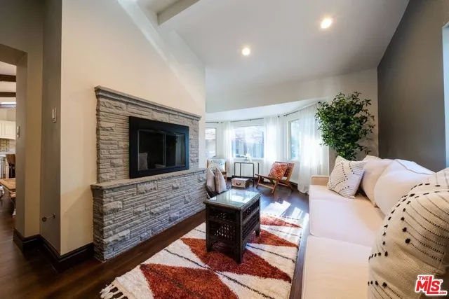 a view of a house with backyard sitting area and swimming pool