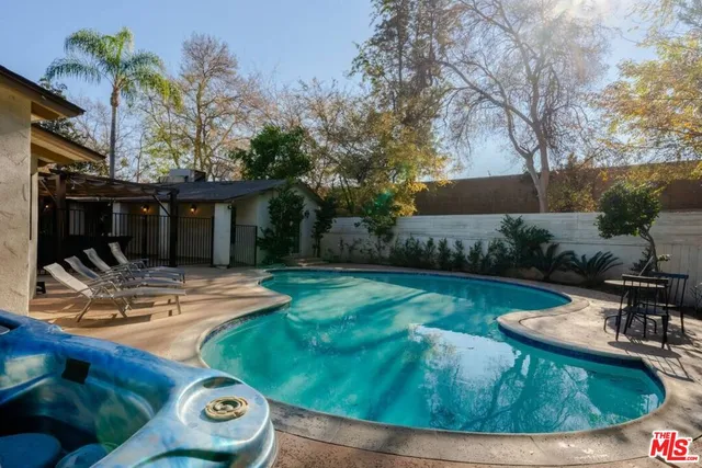 a living room with furniture fireplace and flat screen tv