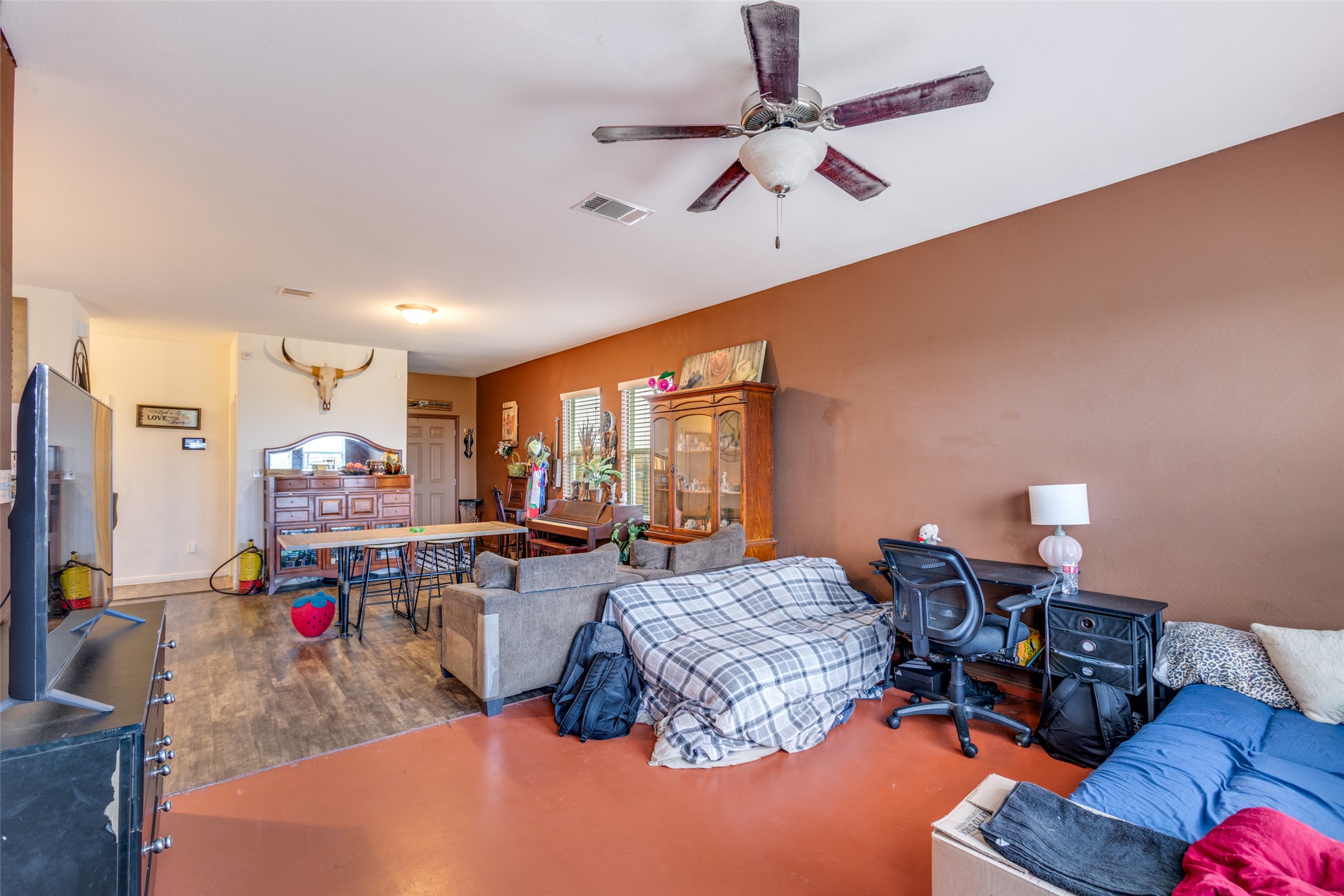 13909 Sherri Berry Way Manor, TX 78653 - Photo 15 of 28 Open-concept living area with a ceiling fan light fixture and a double-door entry