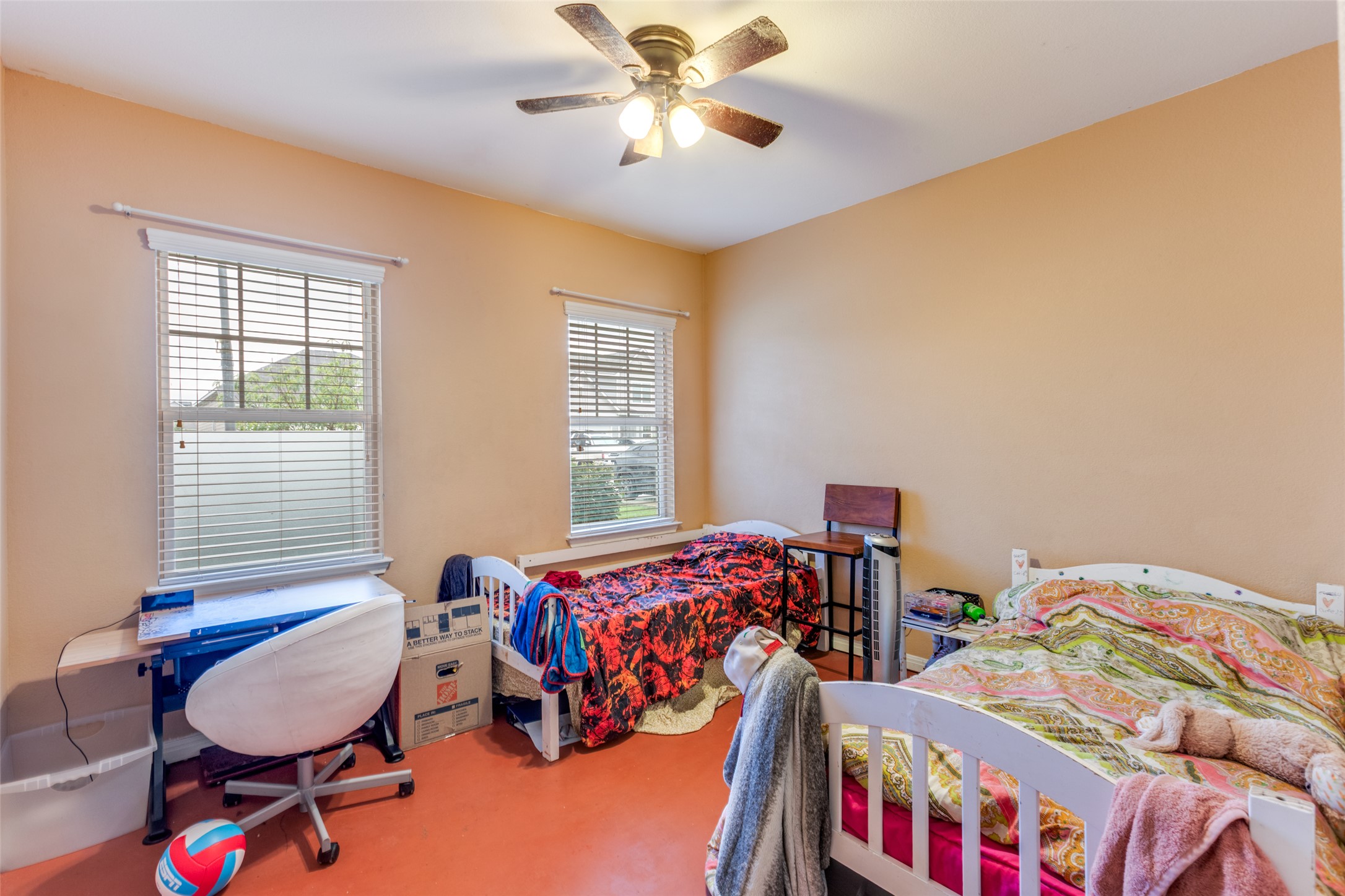 13909 Sherri Berry Way Manor, TX 78653 - Photo 17 of 28 Bright room with two windows featuring horizontal blinds