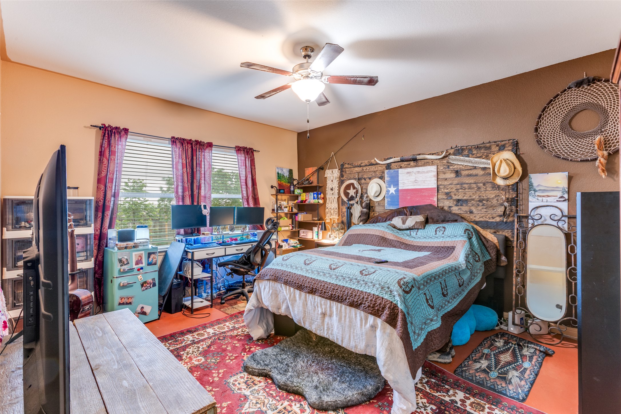 13909 Sherri Berry Way Manor, TX 78653 - Photo 9 of 28 Spacious room featuring multiple window openings, ceiling fan, and wall-to-wall carpeting