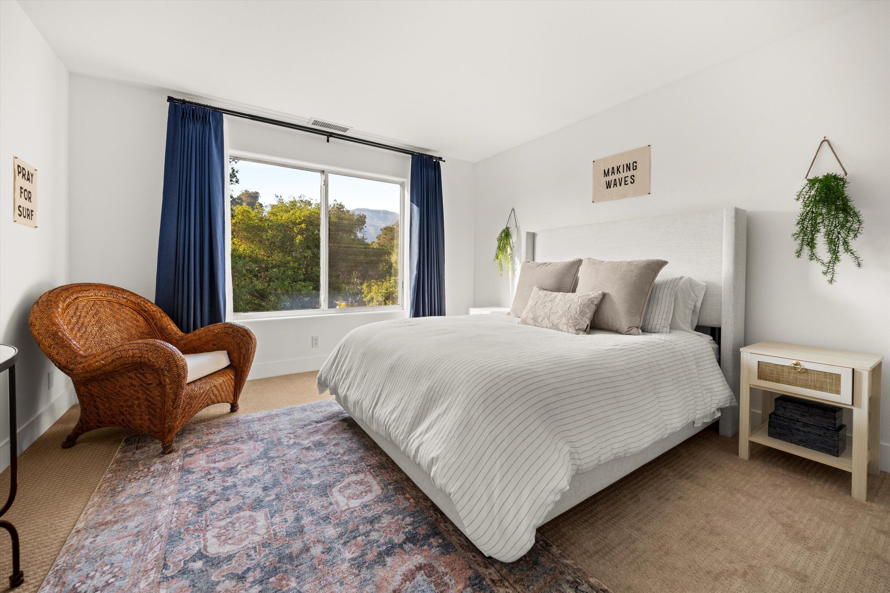 1378 Sycamore Canyon Road Santa Barbara, CA 93108 - Photo 13 of 28 a bedroom with a bed chair and a large window