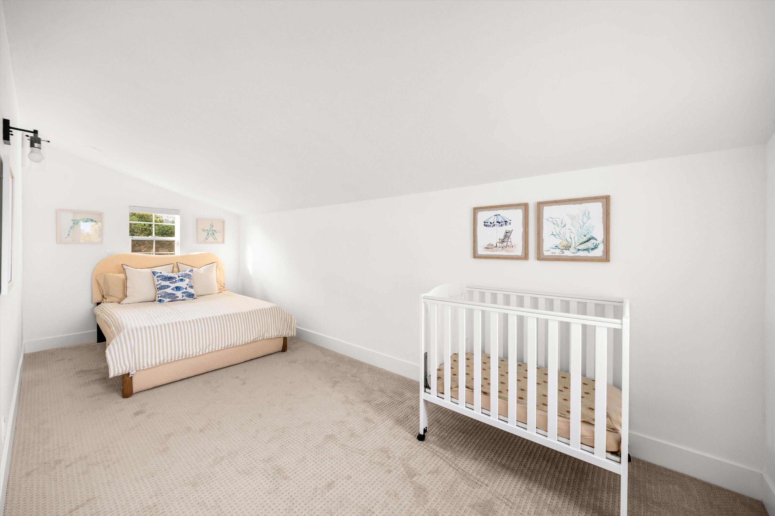 1378 Sycamore Canyon Road Santa Barbara, CA 93108 - Photo 14 of 28 a bedroom with a white bed and a couch