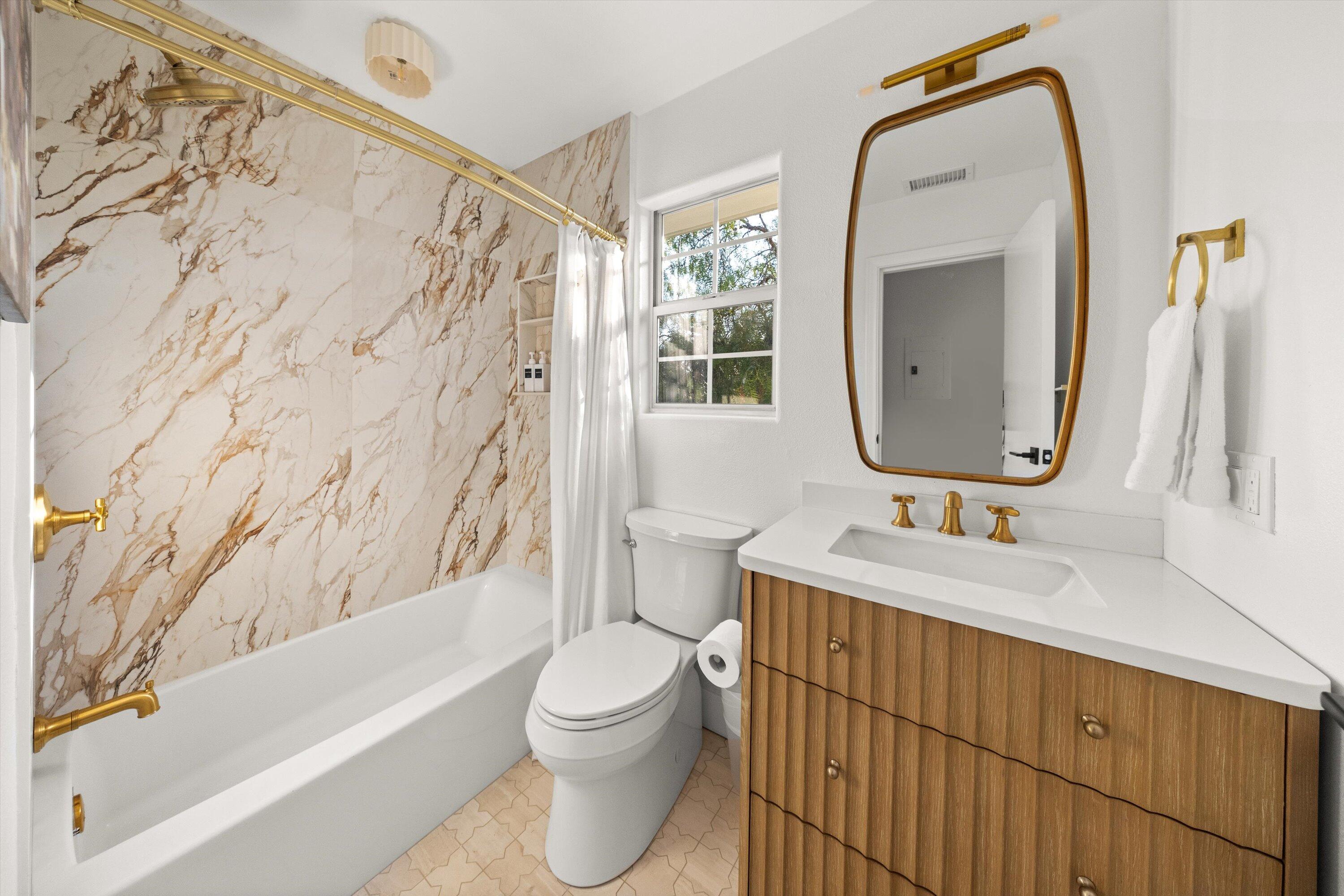 1378 Sycamore Canyon Road Santa Barbara, CA 93108 - Photo 15 of 28 a bathroom with a sink toilet and shower