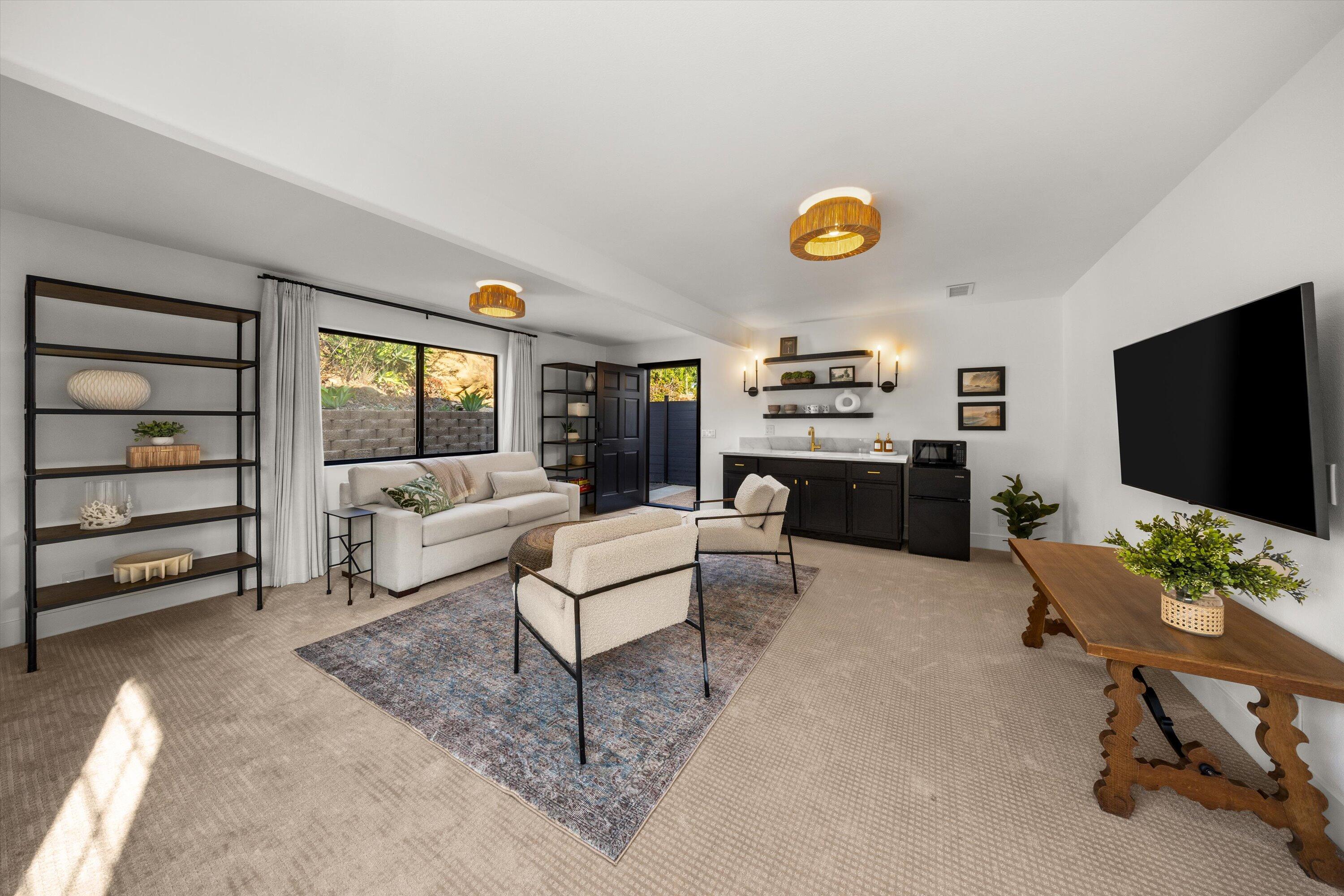 1378 Sycamore Canyon Road Santa Barbara, CA 93108 - Photo 17 of 28 a living room with furniture and a flat screen tv
