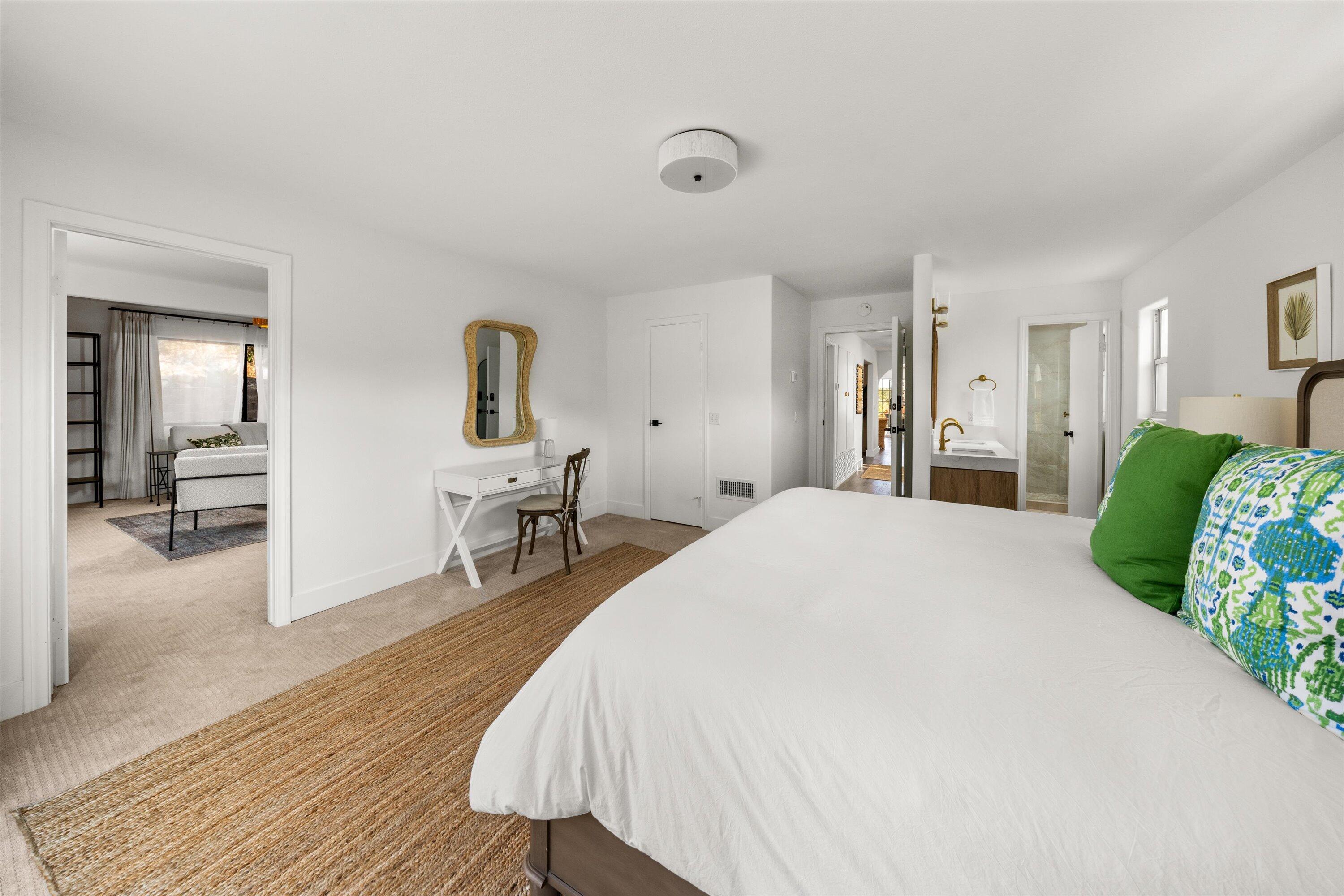 1378 Sycamore Canyon Road Santa Barbara, CA 93108 - Photo 19 of 28 a spacious bedroom with a bed and a chair