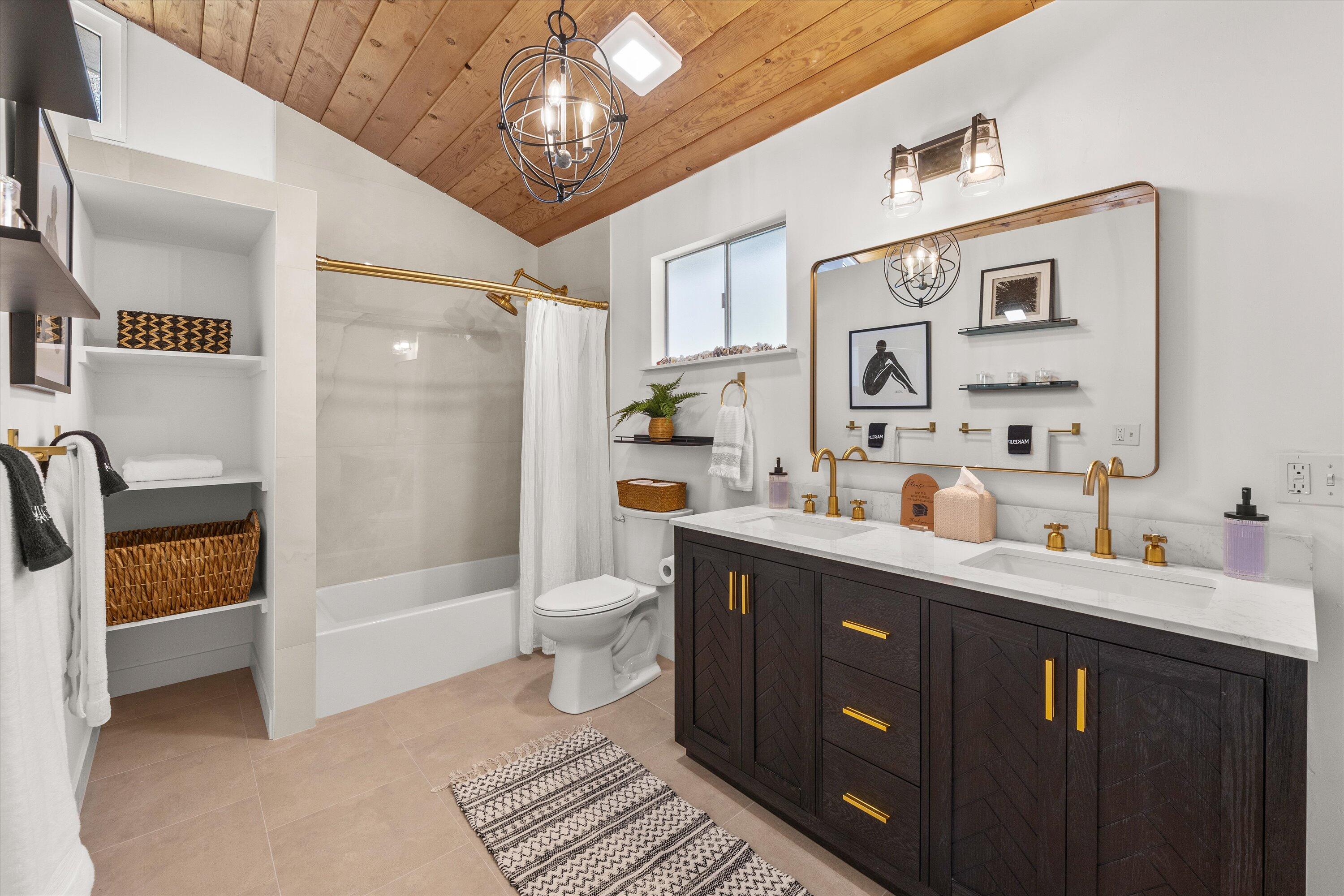 1378 Sycamore Canyon Road Santa Barbara, CA 93108 - Photo 23 of 28 a bathroom with a sink a toilet and shower