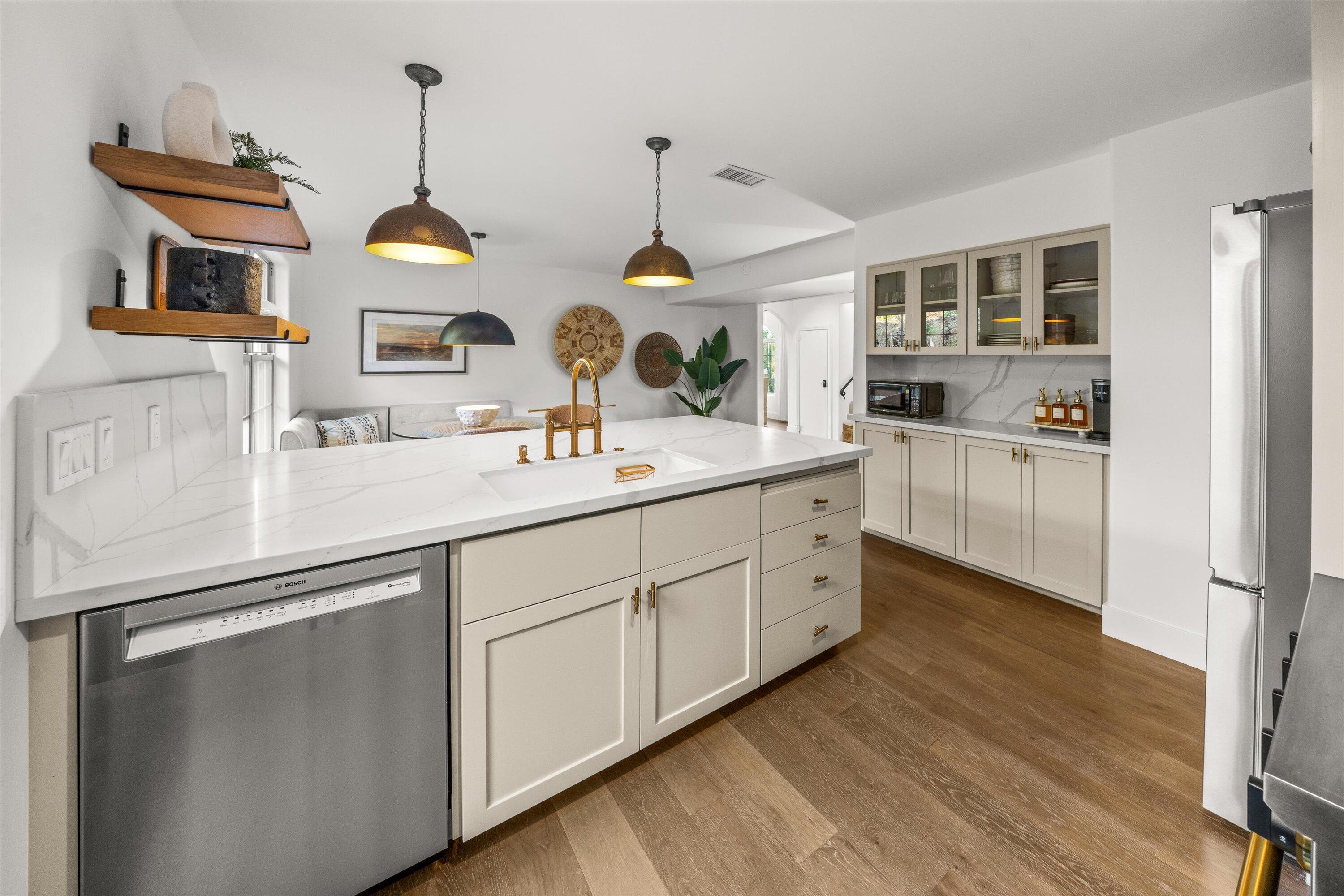 1378 Sycamore Canyon Road Santa Barbara, CA 93108 - Photo 7 of 28 a spacious kitchen with stainless steel appliances a sink and wooden floor