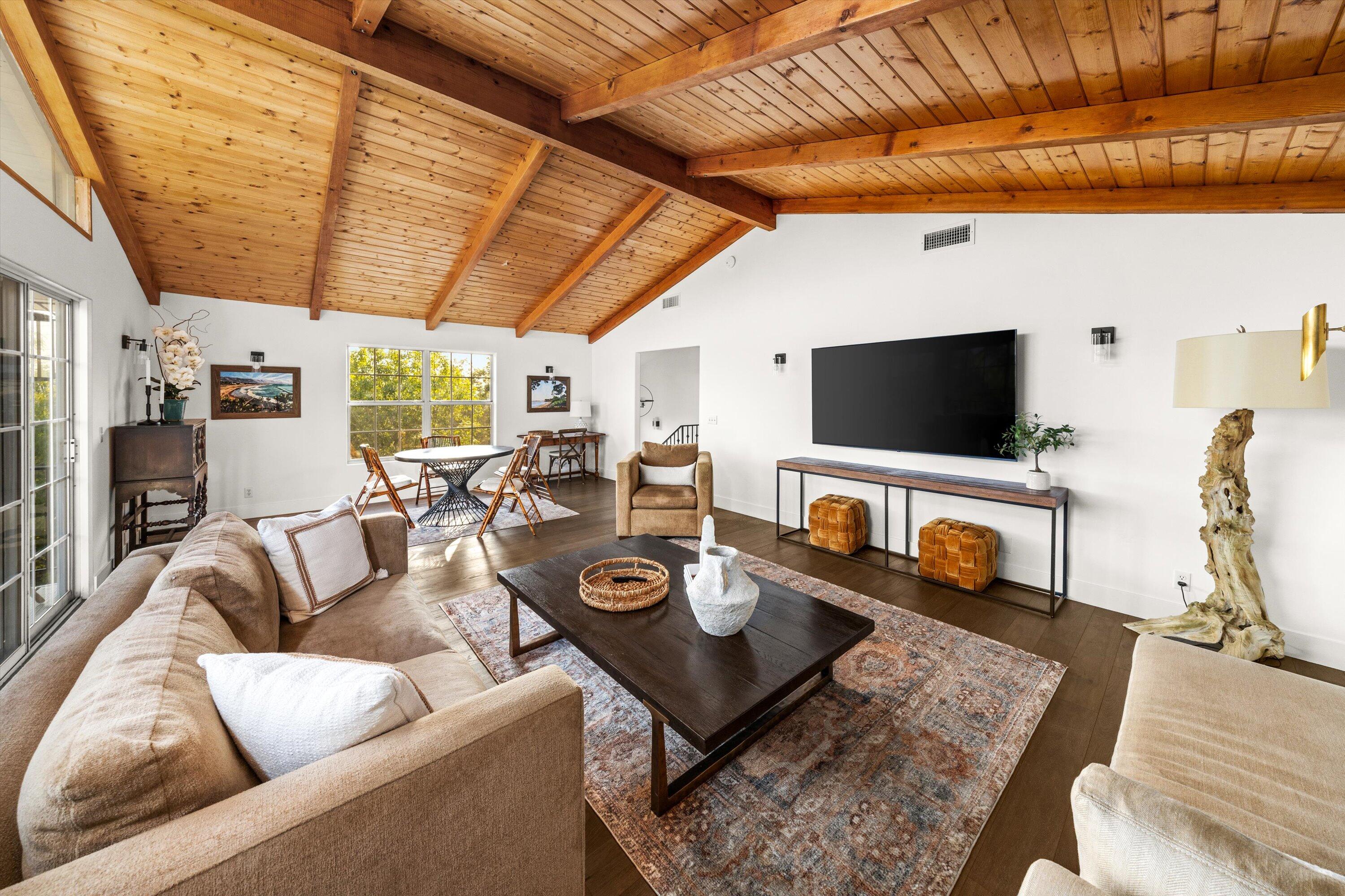 1378 Sycamore Canyon Road Santa Barbara, CA 93108 - Photo 8 of 28 a living room with furniture a flat screen tv and a table
