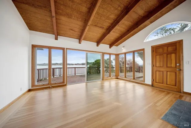 a view of an entryway with wooden floor