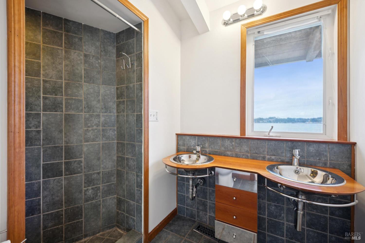 177 Oak Drive San Rafael, CA 94901 - Photo 18 of 27 a bathroom with a sink and a mirror
