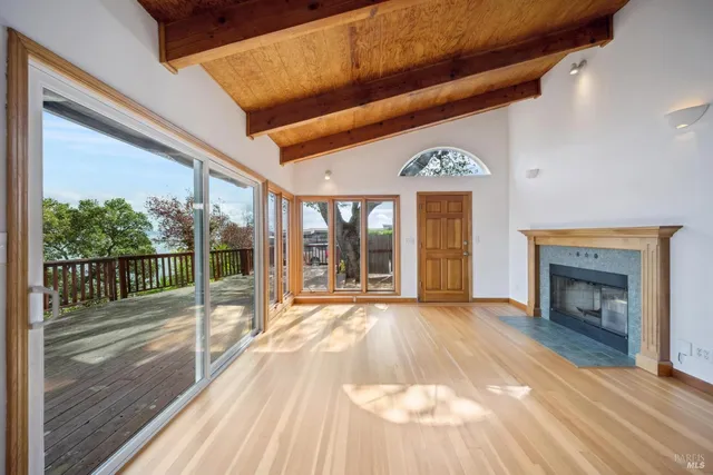a view of an entryway with a floor to ceiling window and fire place