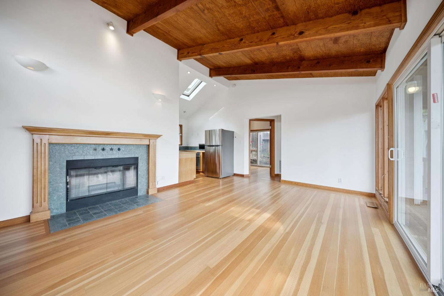 177 Oak Drive San Rafael, CA 94901 - Photo 9 of 27 a view of empty room with wooden floor and fireplace