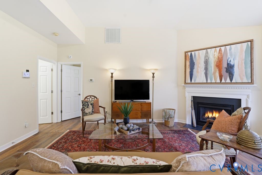 13924 Krim Point Road Midlothian, VA 23114 - Photo 11 of 48 a living room with furniture and a fireplace