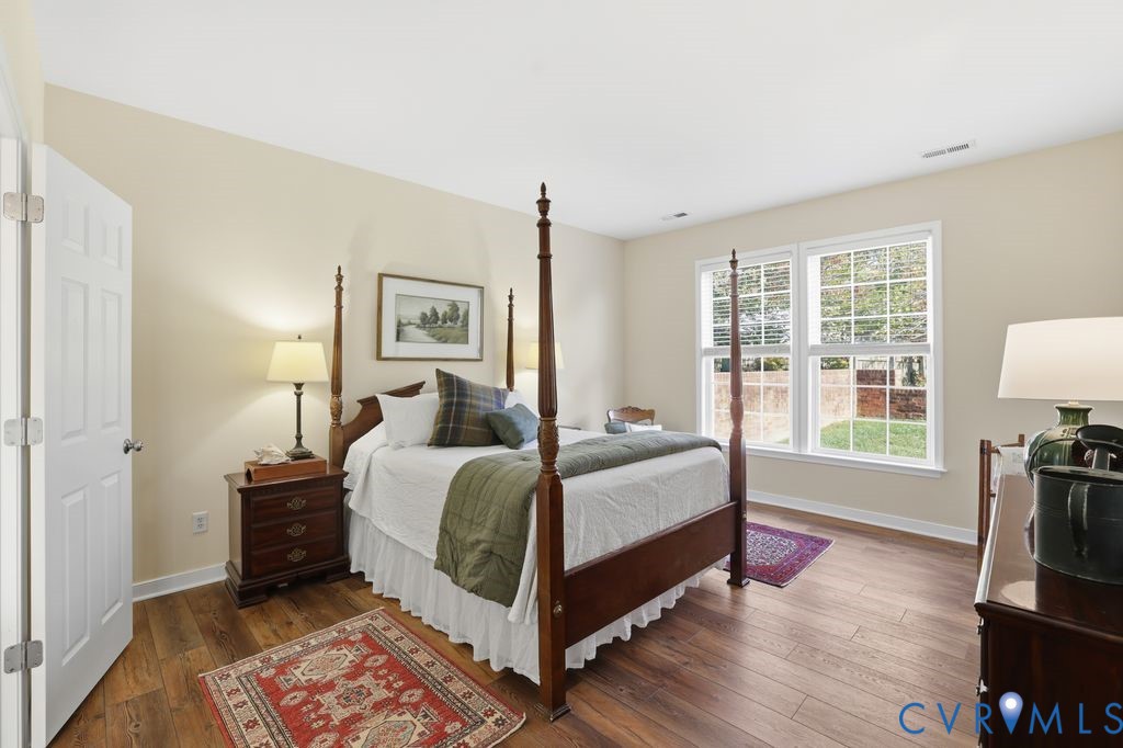 13924 Krim Point Road Midlothian, VA 23114 - Photo 17 of 48 a bedroom with a bed and a tv on table