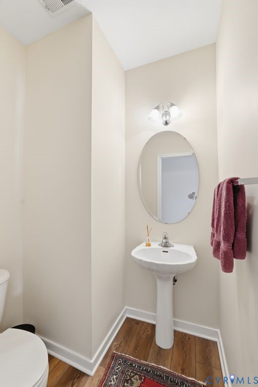 13924 Krim Point Road Midlothian, VA 23114 - Photo 24 of 48 a bathroom with a sink toilet and mirror