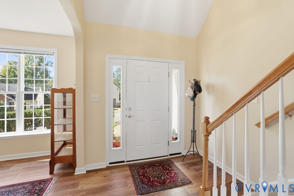 13924 Krim Point Road Midlothian, VA 23114 - Photo 25 of 48 a view of an entryway with wooden floor and door