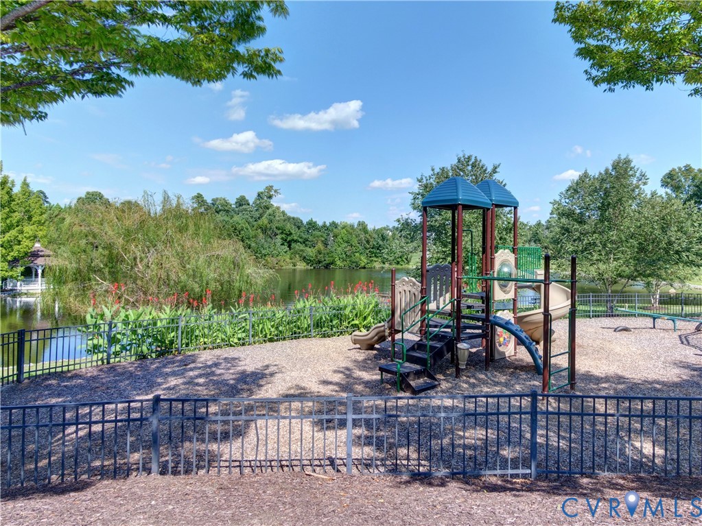 13924 Krim Point Road Midlothian, VA 23114 - Photo 40 of 48 a view of a lake with a patio
