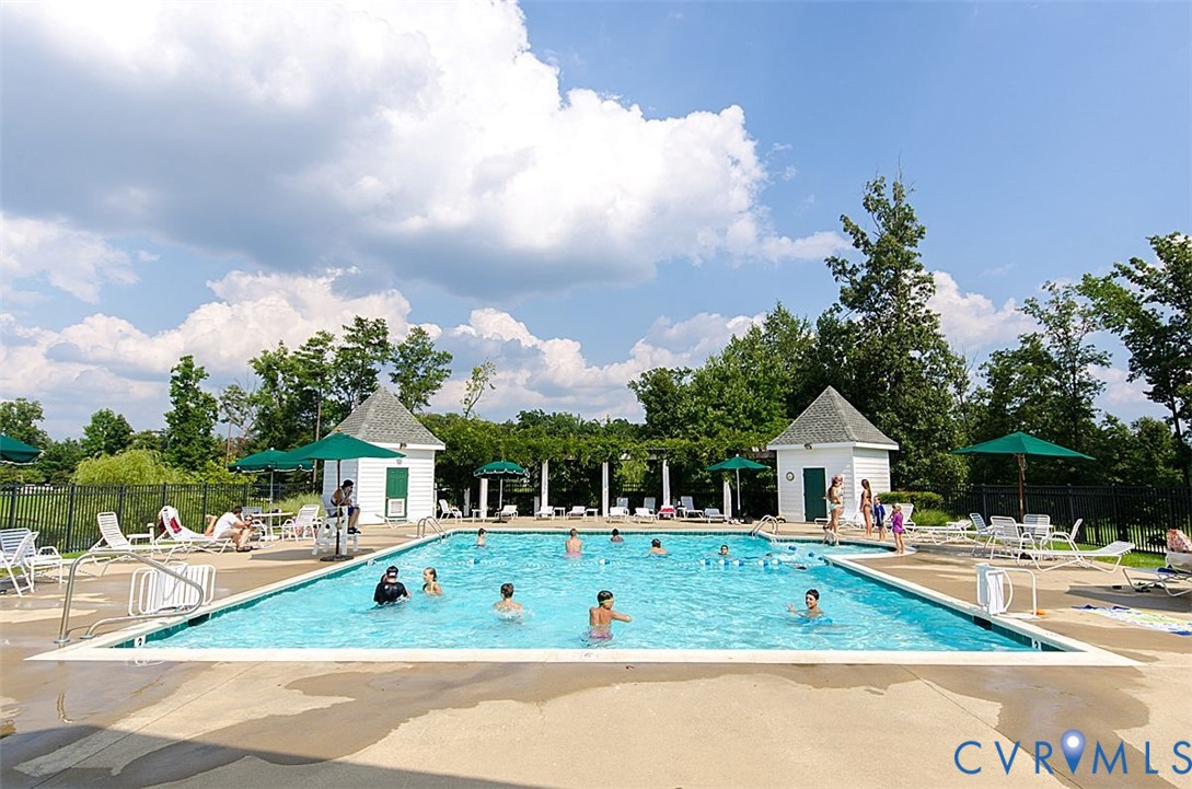 13924 Krim Point Road Midlothian, VA 23114 - Photo 42 of 48 a front view of house with yard outdoor seating and barbeque oven