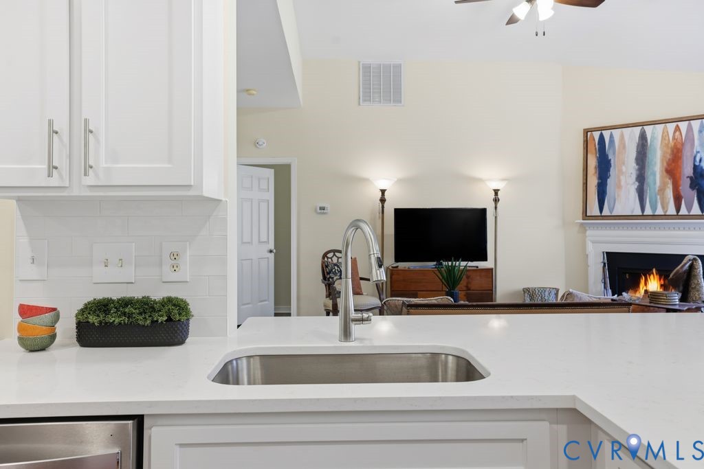13924 Krim Point Road Midlothian, VA 23114 - Photo 7 of 48 a kitchen with a sink and a stove top oven