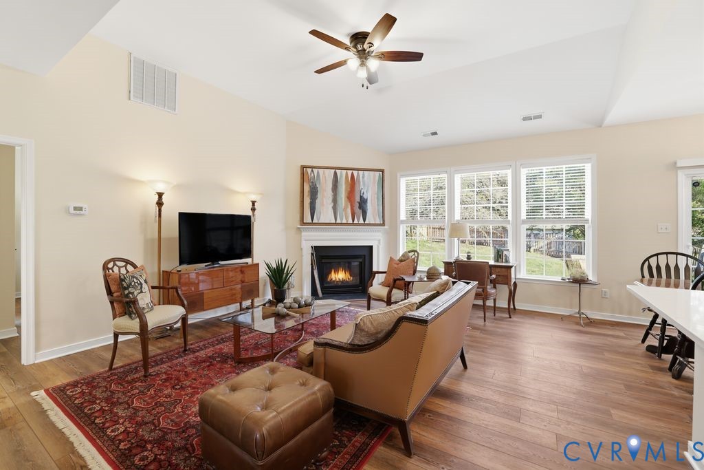 13924 Krim Point Road Midlothian, VA 23114 - Photo 9 of 48 a living room with furniture or couch and a fireplace