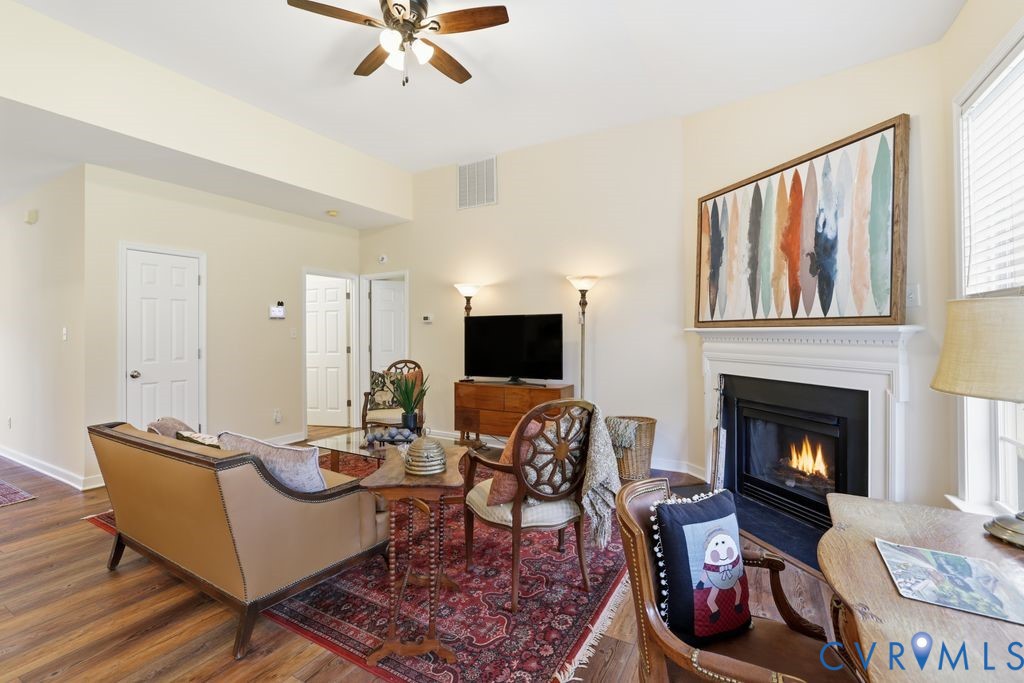 13924 Krim Point Road Midlothian, VA 23114 - Photo 10 of 48 a living room with furniture fireplace and a window
