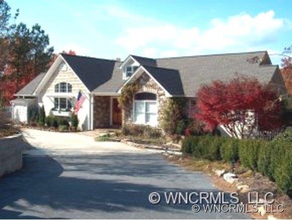 901 Hawk Ridge Drive Mill Spring, NC 28756 - Photo 1 of 12 a view of a house with a yard