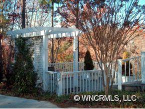901 Hawk Ridge Drive Mill Spring, NC 28756 - Photo 10 of 12 a view of a door with a tree