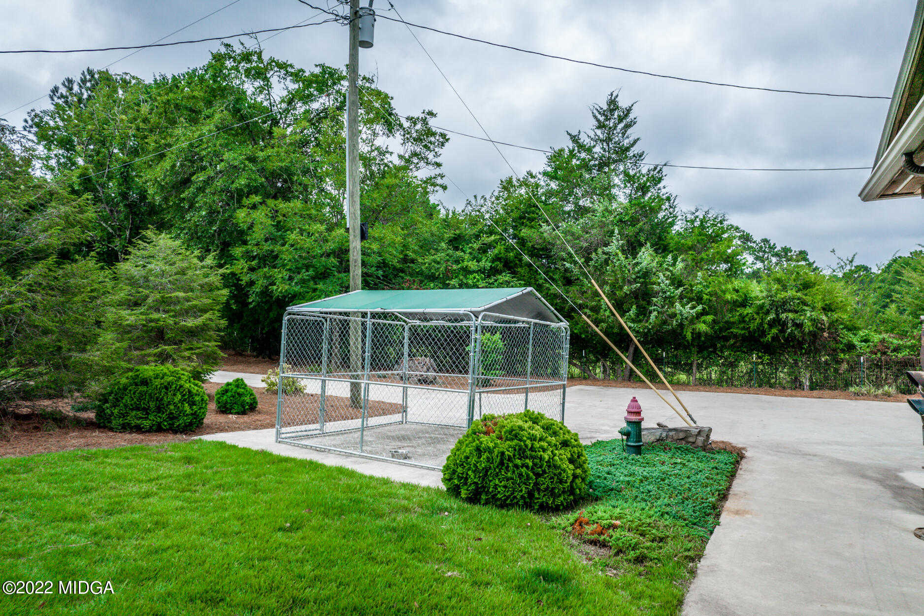 265 Blount Road Forsyth, GA 31029 - Photo 25 of 70 a front view of a house with a yard and potted plants