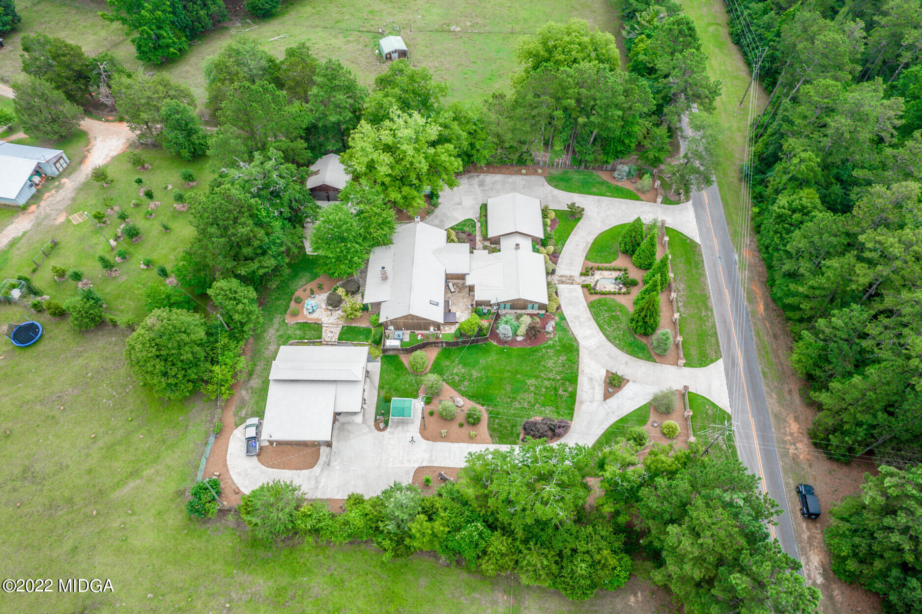 265 Blount Road Forsyth, GA 31029 - Photo 3 of 70 an aerial view of a house with garden space and trees all around