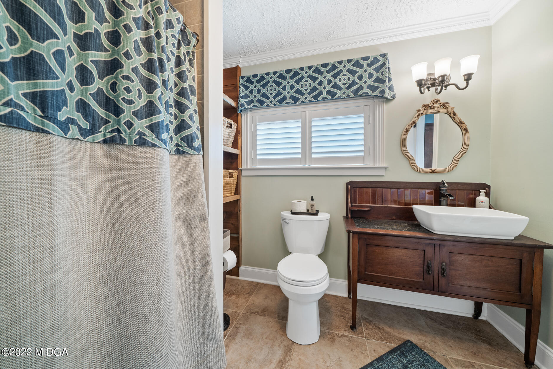 265 Blount Road Forsyth, GA 31029 - Photo 43 of 70 a bathroom with a sink a toilet and a mirror