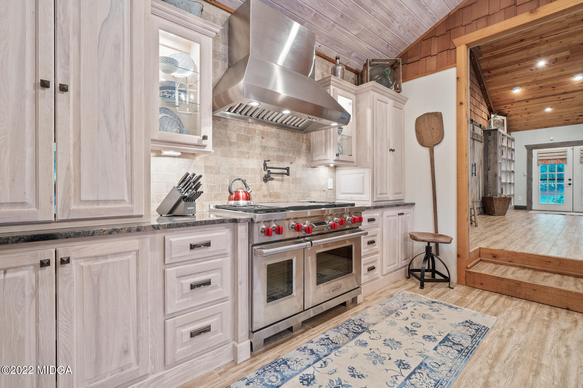 265 Blount Road Forsyth, GA 31029 - Photo 53 of 70 a kitchen with stainless steel appliances granite countertop a sink a stove a refrigerator and cabinets