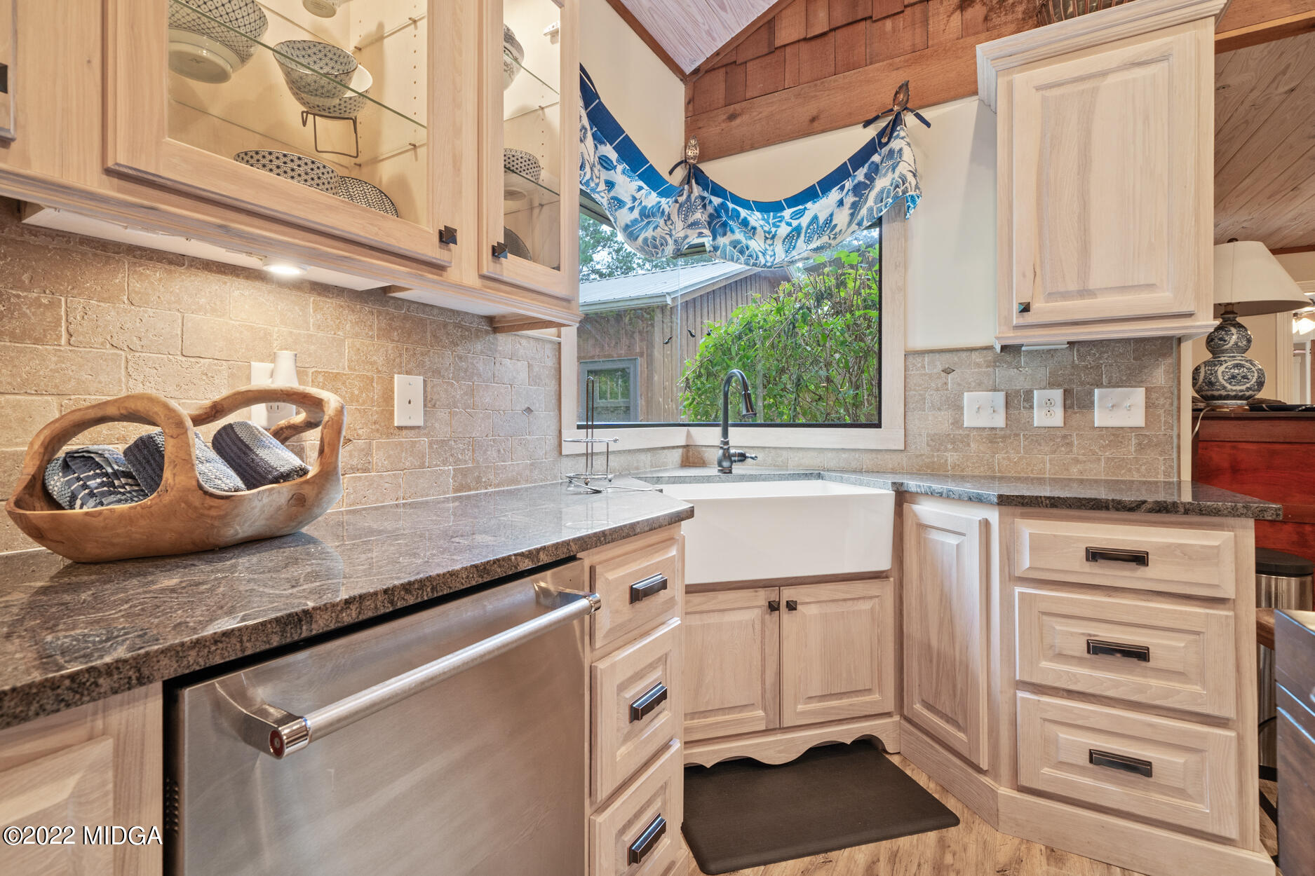 265 Blount Road Forsyth, GA 31029 - Photo 55 of 70 a kitchen with granite countertop white cabinets and white appliances