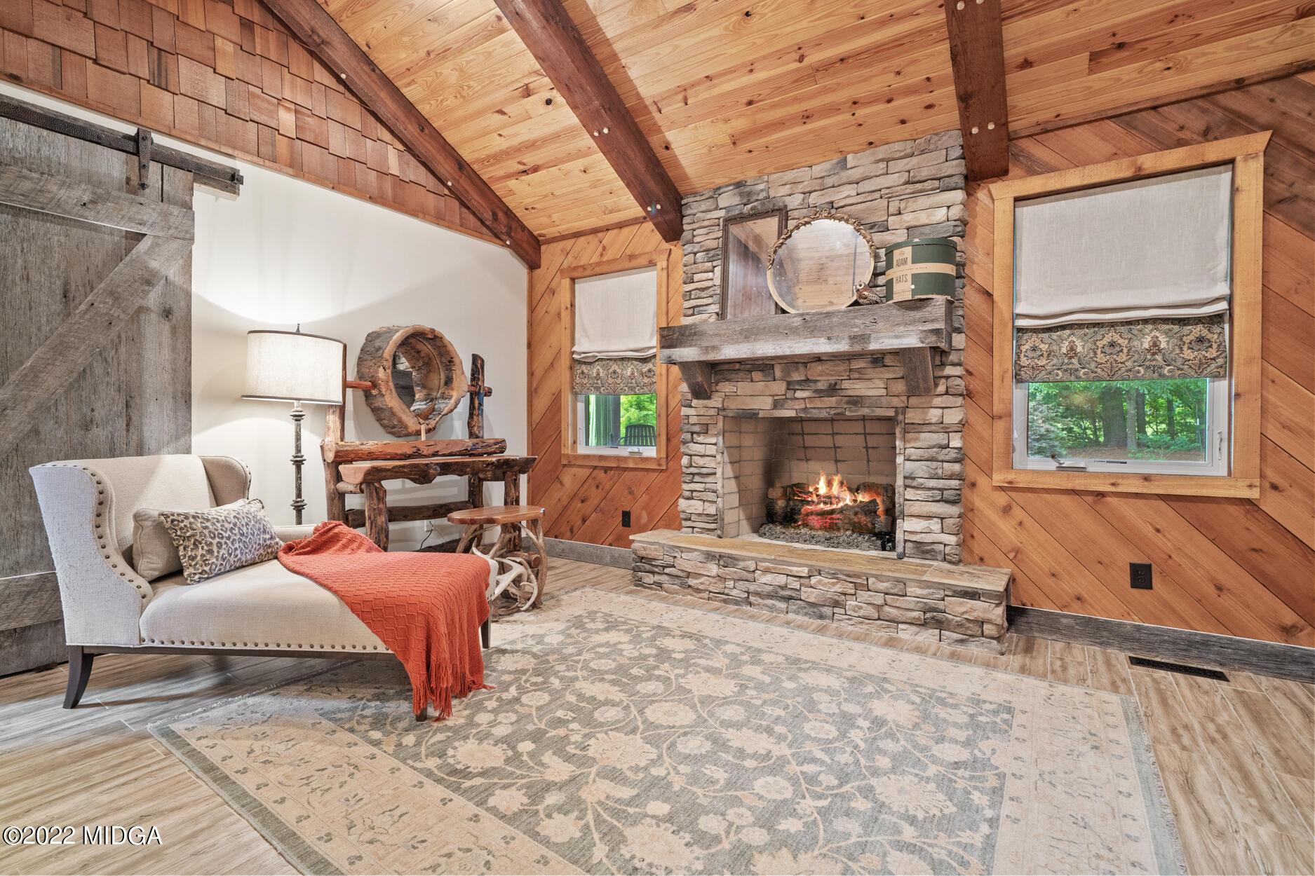 265 Blount Road Forsyth, GA 31029 - Photo 65 of 70 a living room with furniture a fireplace and a table