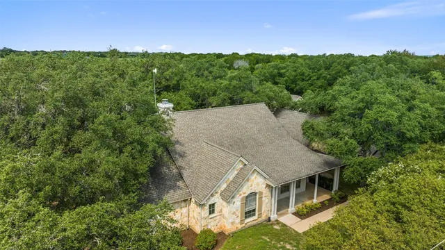 an aerial view of a house with mountain view