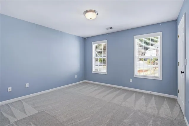 a view of a hallway with staircase