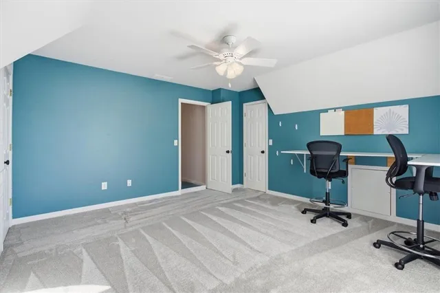 a view of a brick house with a yard