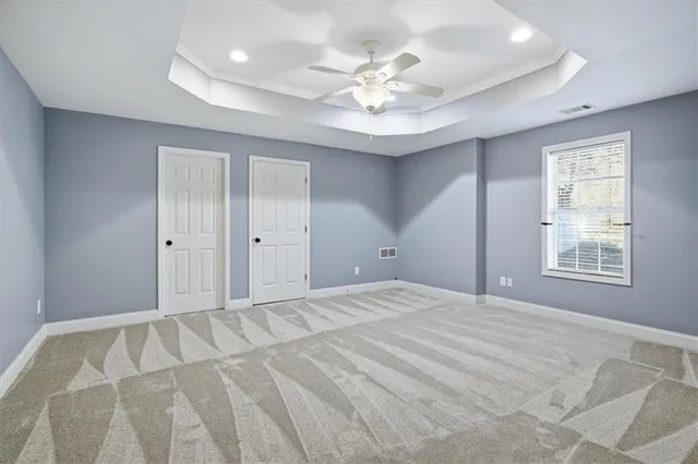 a view of a balcony with wooden floor and fence and a large window
