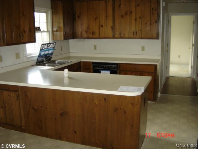 1595 Wickham Road Bumpass, VA 23024 - Photo 3 of 7 a kitchen with a sink and a cabinets