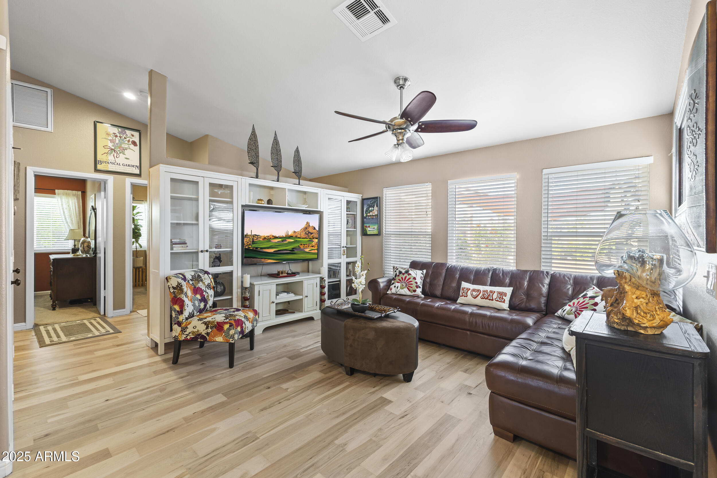 922 West Hudson Way Gilbert, AZ 85233 - Photo 12 of 27 a living room with furniture flat screen tv and a large window