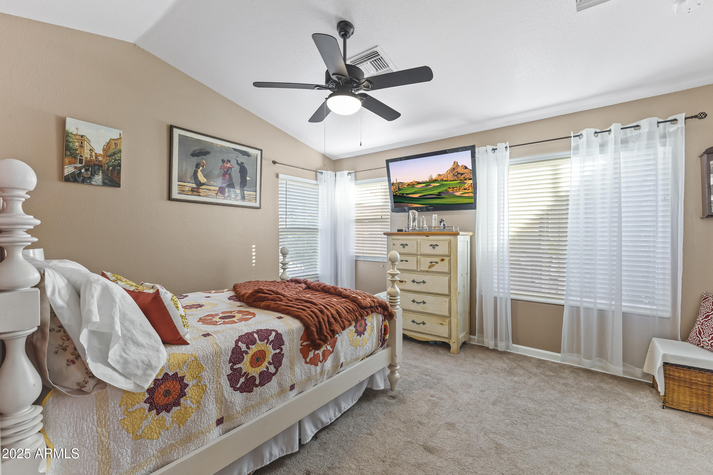 922 West Hudson Way Gilbert, AZ 85233 - Photo 18 of 27 a bedroom with a bed and a flat screen tv