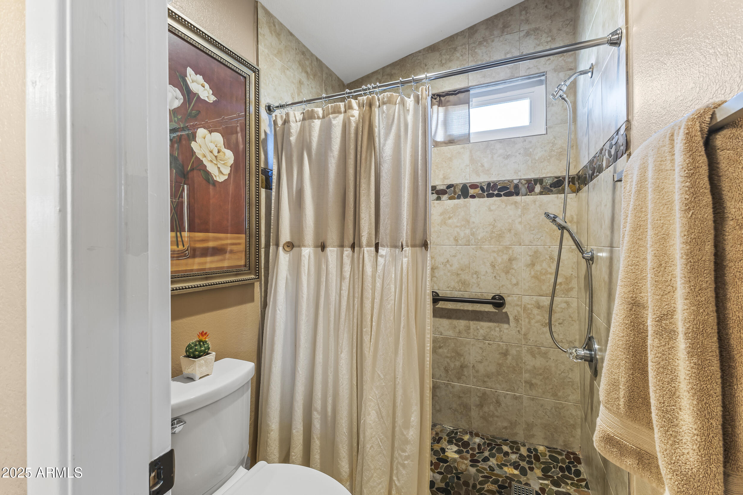 922 West Hudson Way Gilbert, AZ 85233 - Photo 20 of 27 a bathroom with a shower a toilet and a sink