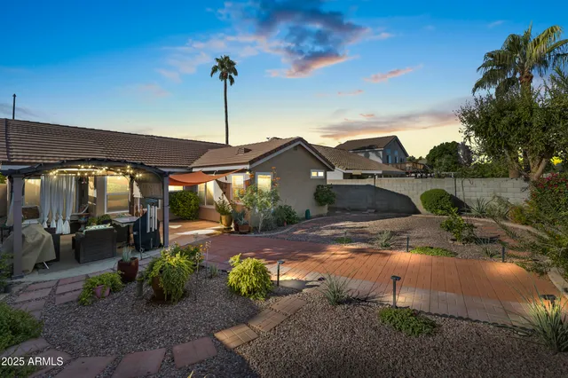a view of a garden with sitting area